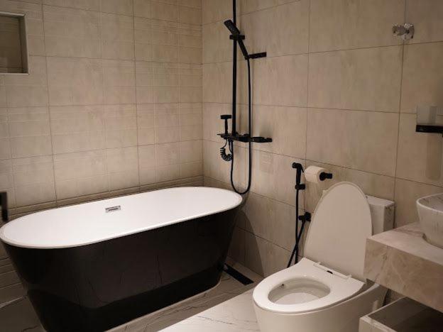 Lavenue Resthouse Apartment Низва Стая снимка